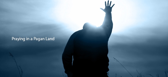 Praying In A Pagan Land poster